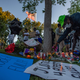 People light up candles as they gather during a vigil, around a makeshift memorial at the tree where Robert Fuller was found dead outside Palmdale City Hall on June 13, 2020, to demand a full investigation into the death of Robert Fuller.